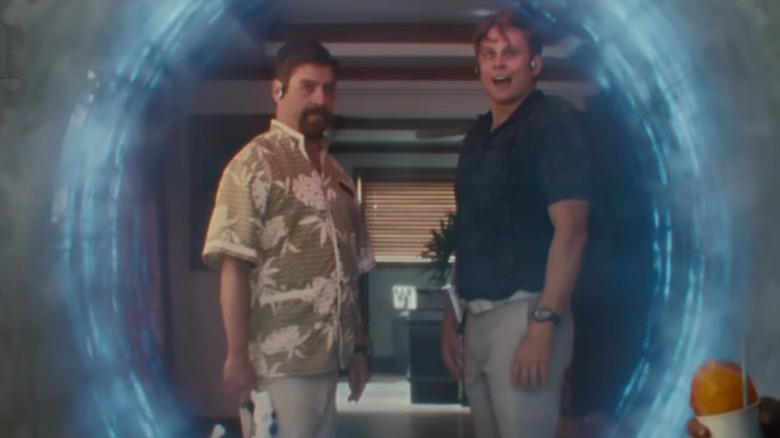 Human forms of Jumba and Pleakley looking through portal