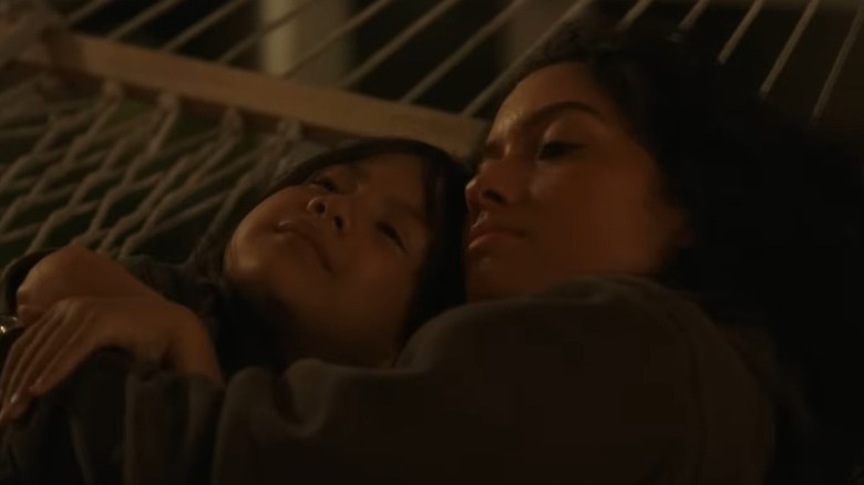Nani and Lilo lying on hammock and hugging