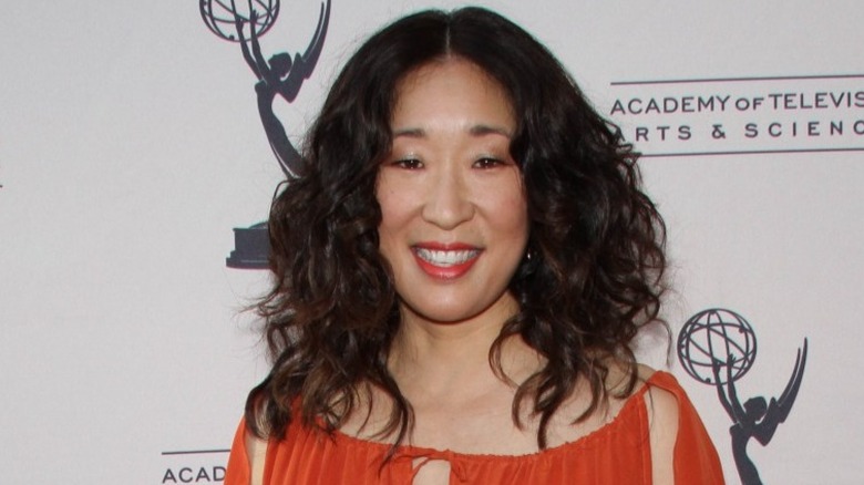 Sandra Oh smiling on red carpet