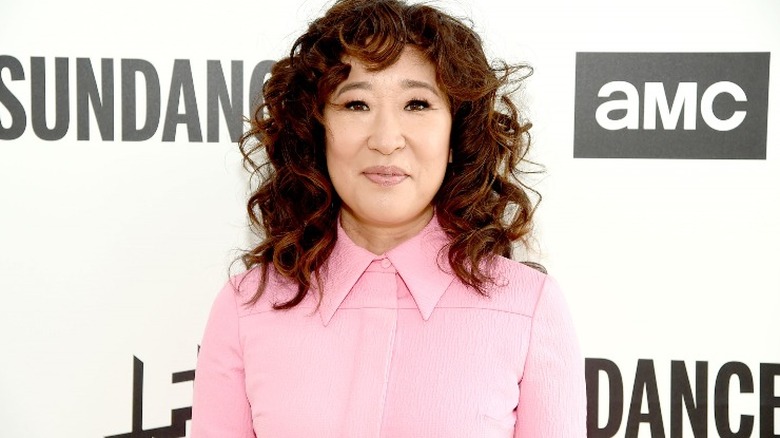 Sandra Oh smiling on red carpet