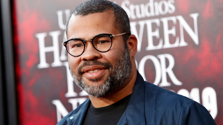 Jordan Peele with glasses and beard