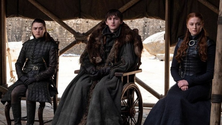 Maisie Williams as Arya Stark, Isaac Hempstead Wright as Bran Stark, and Sophie Turner as Sansa Stark in Game of Thrones