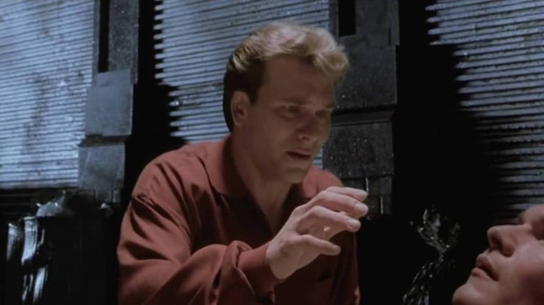 Patrick Swayze as Sam Wheat, gazing down at his own corpse in Ghost