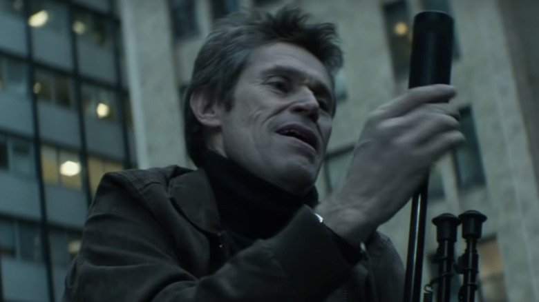 Willem Dafoe with sniper rifle