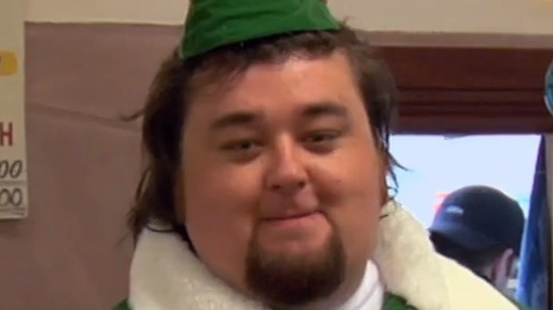 Chumlee enters in an elf suit