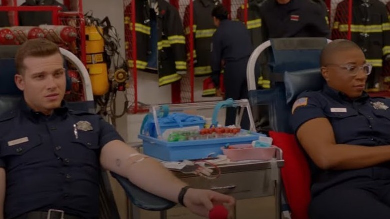Aisha Hinds and Oliver Stark give blood in 9-1-1