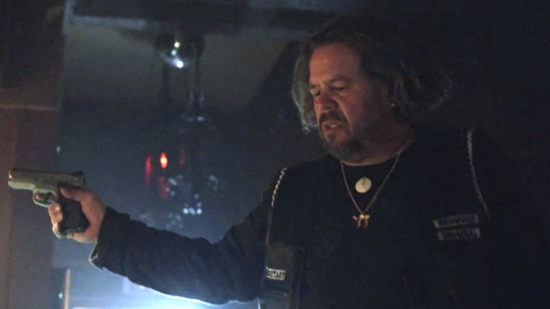 Bobby Elvis holding a gun