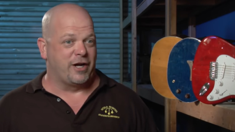 Rick Harrison speaking by shelves