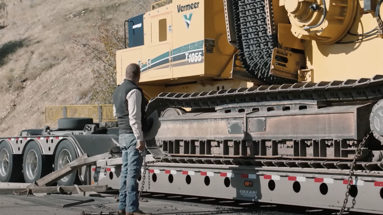 John Dutton next to giant trailer