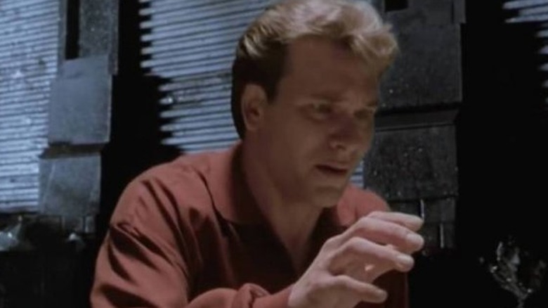 Sam Wheat looks down at his own dead body