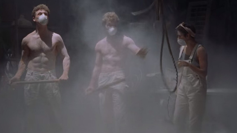 Carl, Sam, and Molly wait for dust to clear while wearing masks