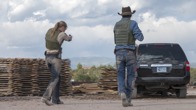 Walt and Vic holding guns