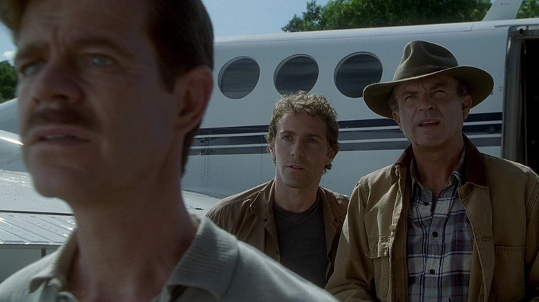 Dr. Grant and survivors stare