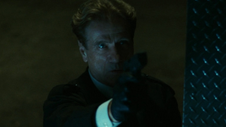 Andre Vernet with gun
