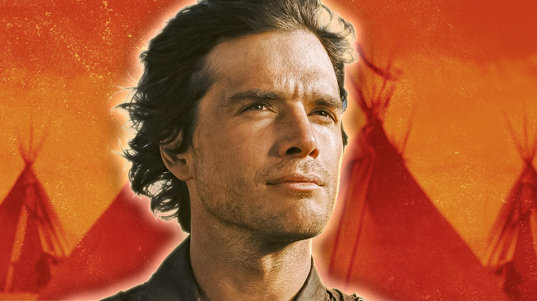 Jacob Wheeler looking determined in Into the West against a backdrop of teepees
