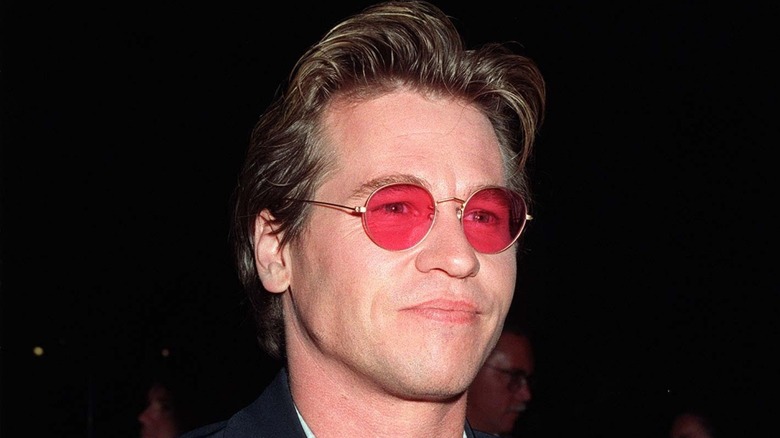 Val Kilmer in red glasses 