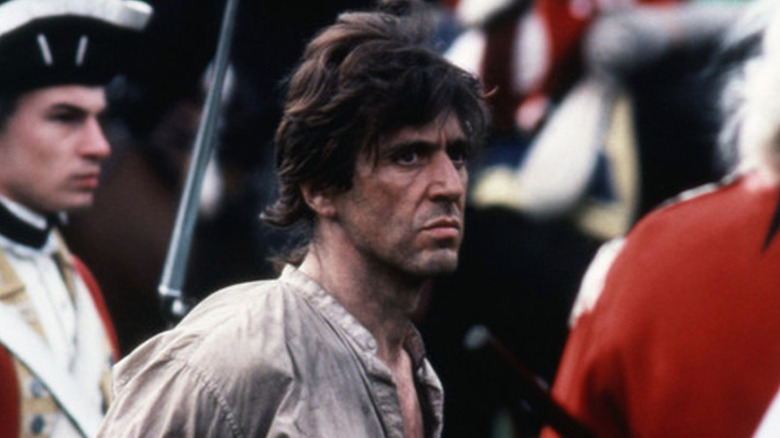Tom Dobb glaring after being taken hostage in "Revolution" (1985)