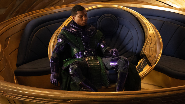 Kang sits in a chair