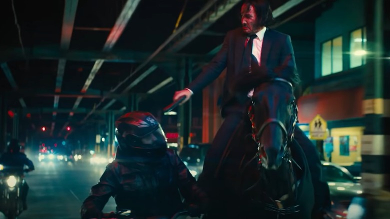 John Wick on horse shooting bad guy