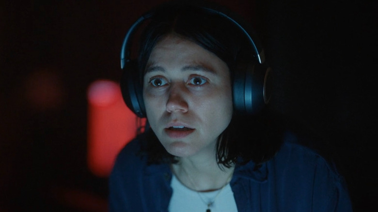 Evy wearing headphones in 