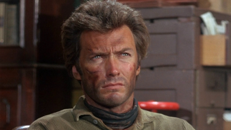 Marshal Jed Cooper talking to Judge Fenton in his office in "Hang 'Em High" (1968)