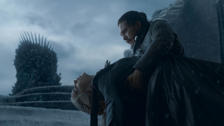 Jon Snow holding Daenerys Targaryen's body on Game of Thrones