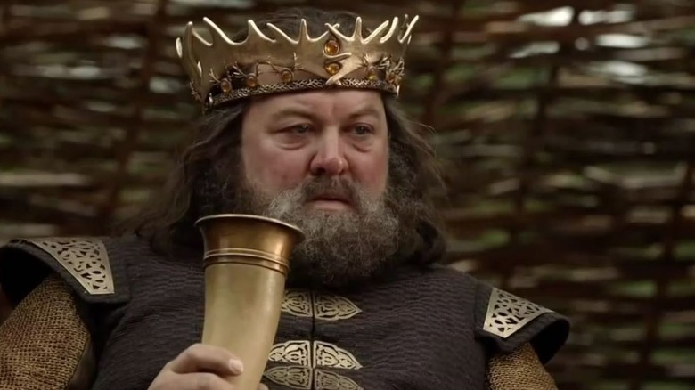 King Robert Baratheon holding a drinking horn