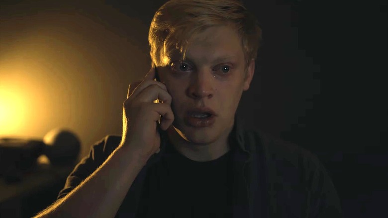 Curry Barker on the phone while crying in Heavy Eyes