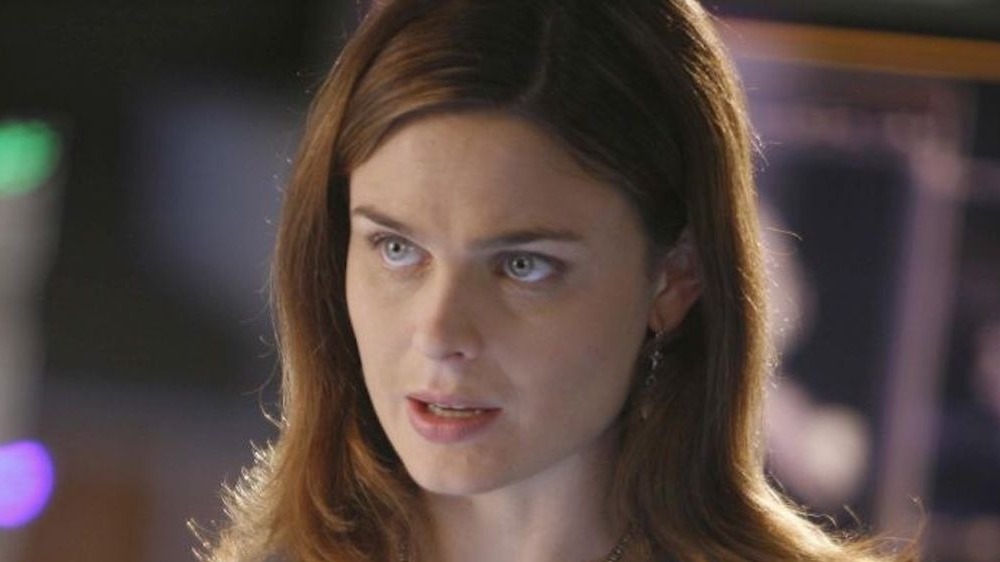 Deschanel looking at bones