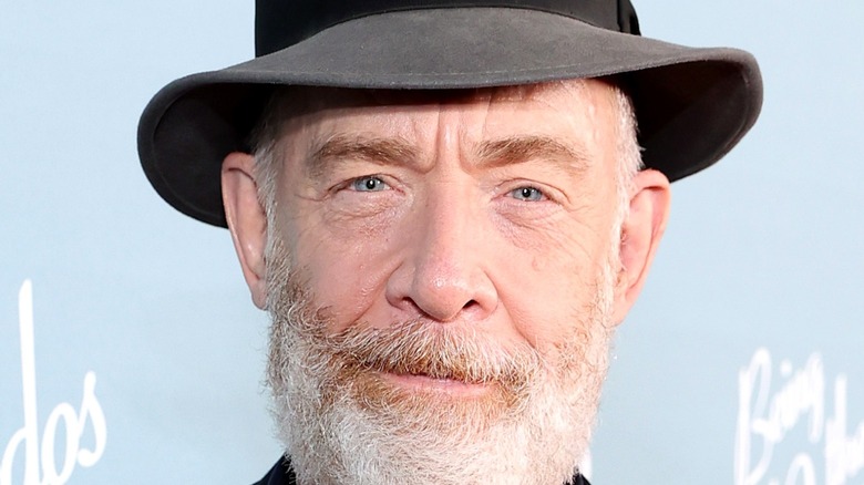 J.K. Simmons smiling at event 