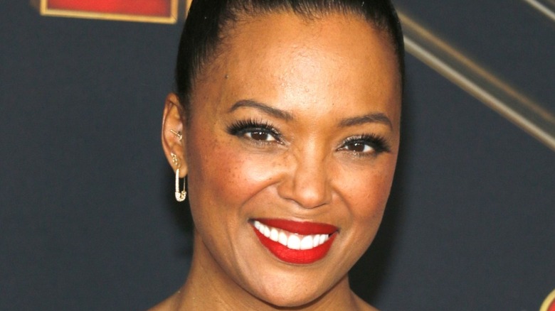 Aisha Tyler smiling at event