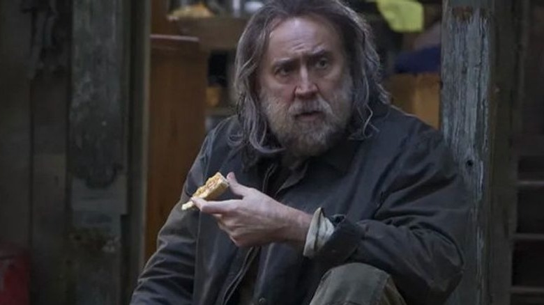 Rob eating with his pig