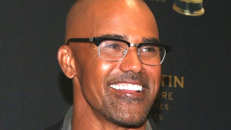 Shemar Moore smiling with glasses on
