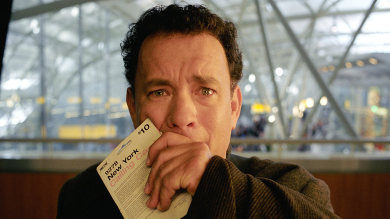 Tom Hanks covering mouth