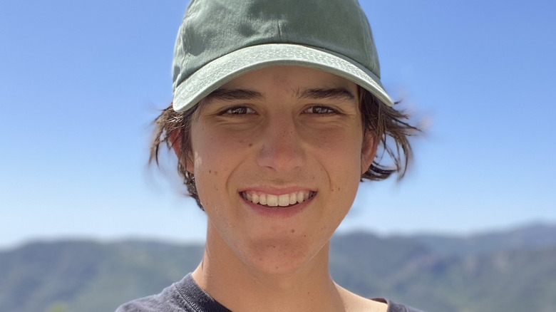 Aidan Barton smiling with baseball hat