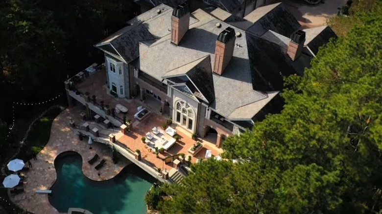 Aerial shot of a mansion and swimming pool