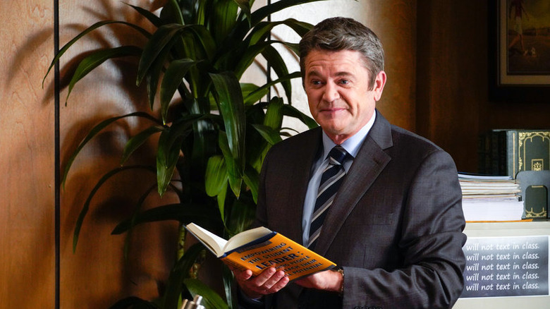 John Michael Higgins with book in hand