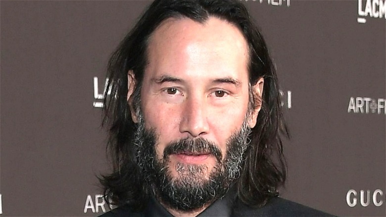 Keanu Reeves smiles