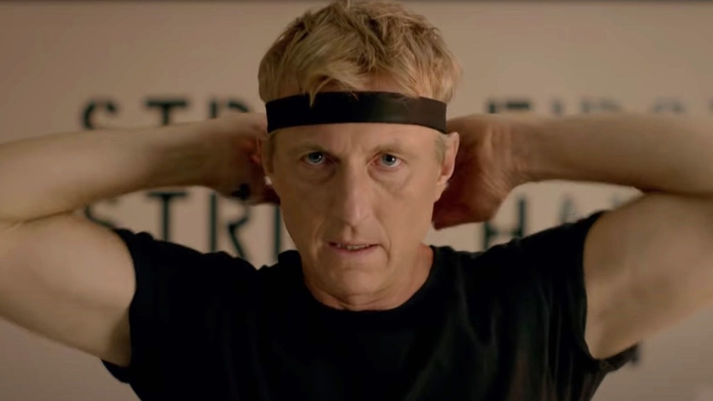 Johnny Lawrence ties headband