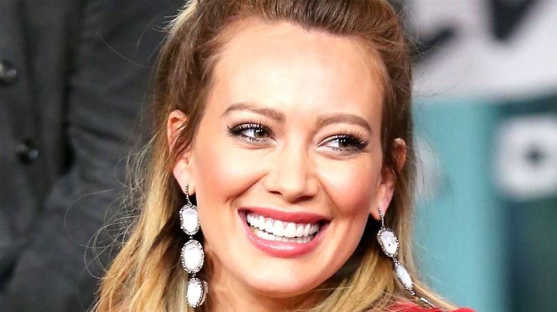 Hillary Duff smiling with earrings