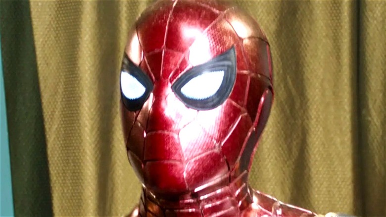 Iron Spider standing in front of curtain