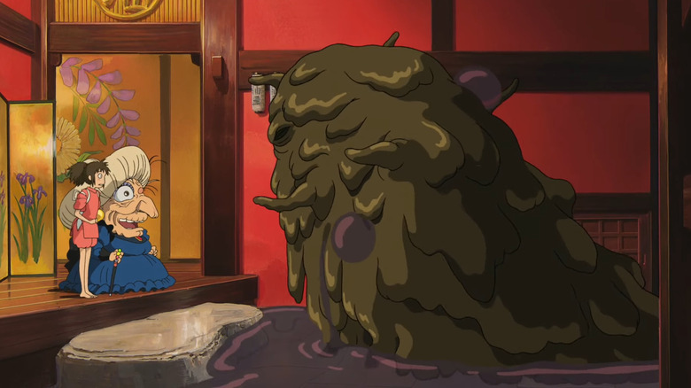 Chihiro and Yubaba next to Stink Spirit