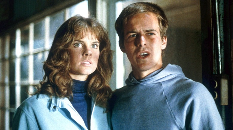 Dennis and Leigh standing side by side in 