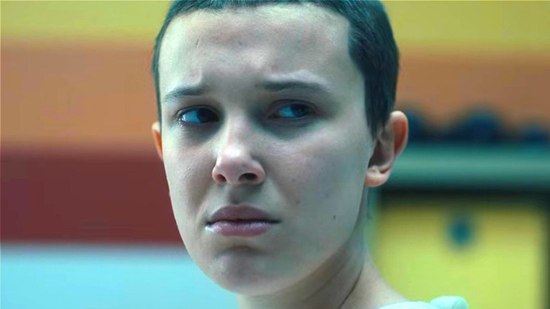 Eleven looking concerned in Stranger Things