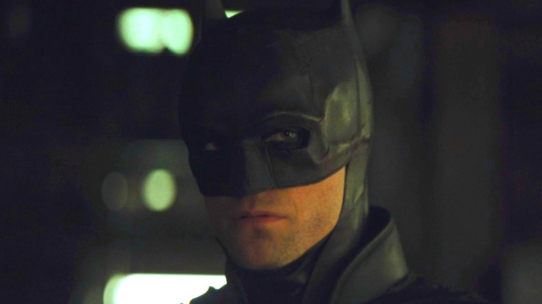 Robert Pattinson as Batman staring menacingly