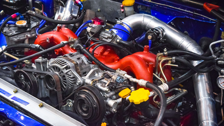 A Subaru EJ20 engine in the car's engine bay.