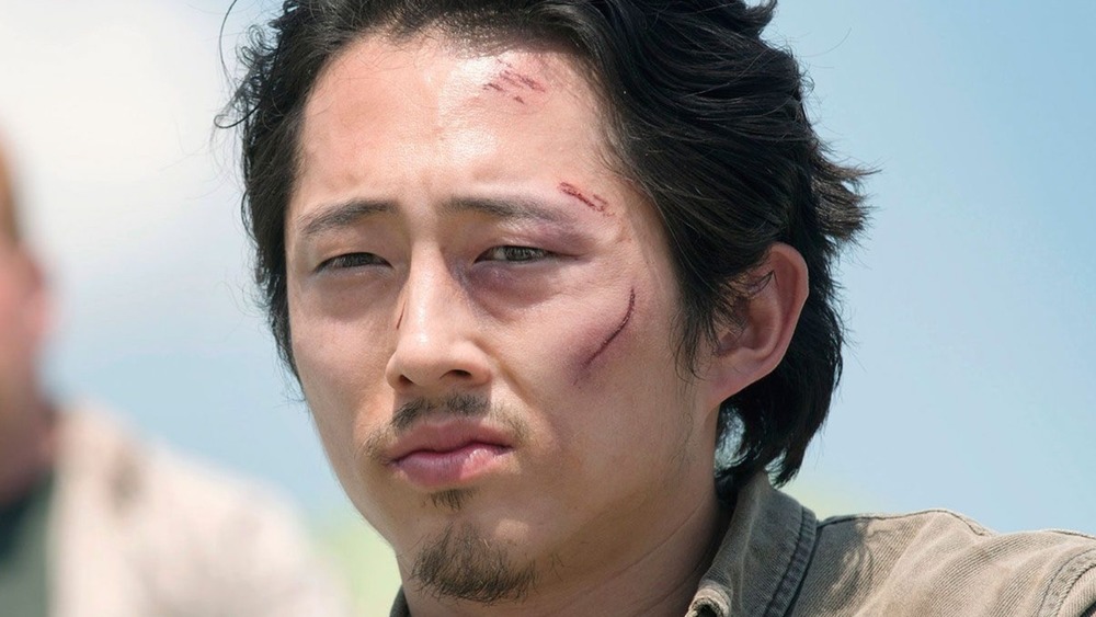 Glenn Rhee cuts on face