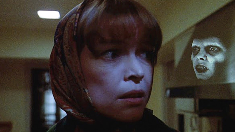 Ellen Burstyn looking around in fear