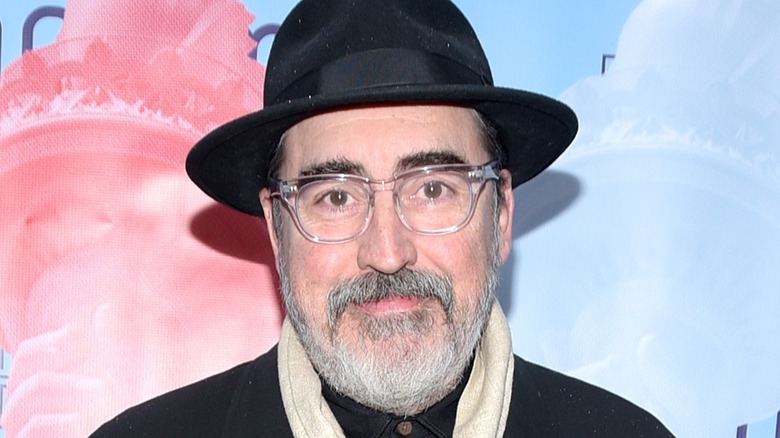 Alfred Molina wearing hat