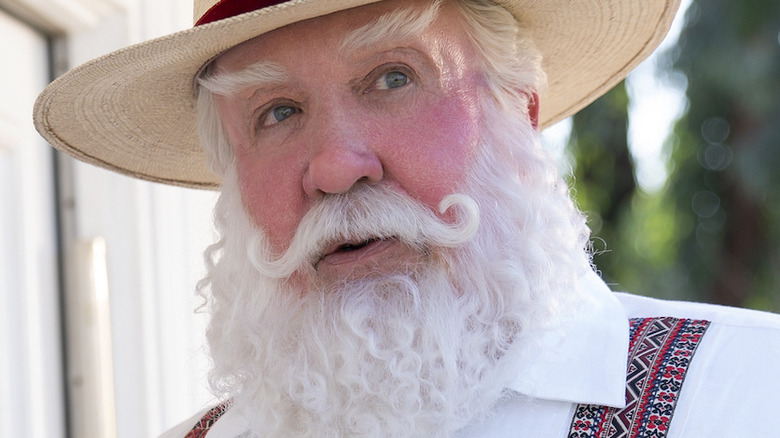 Santa Claus raising his eyebrows with hat on